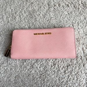 Michale Kors pink Saffiano leather wallet.